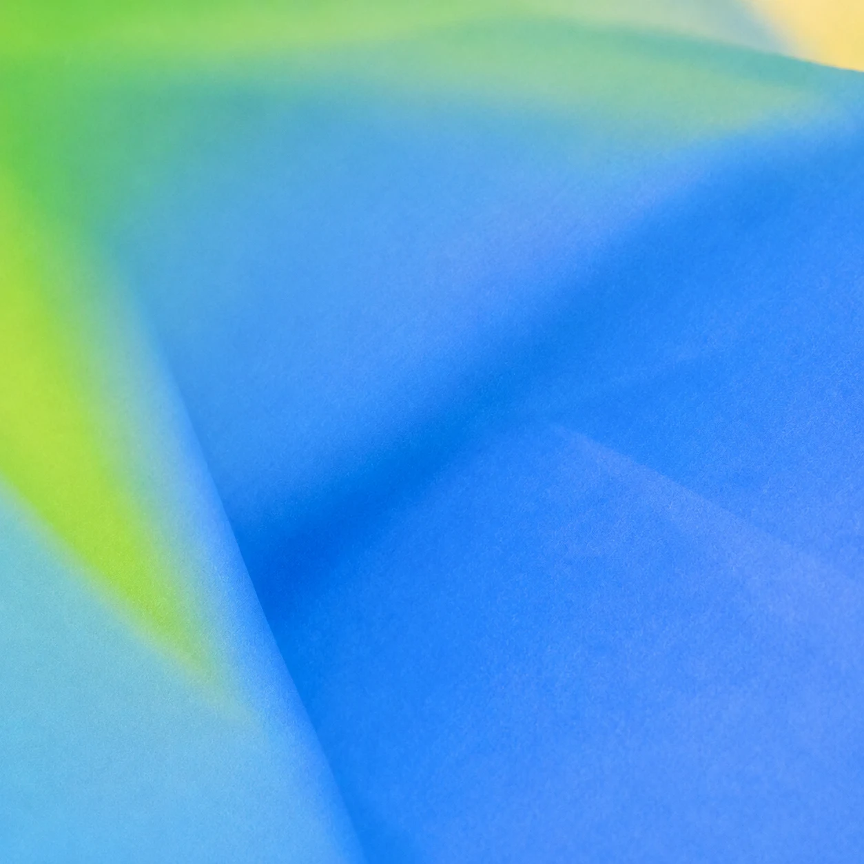 An abstract blue and green textured gradient